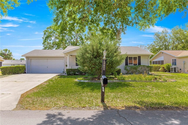 10989 SW 86th Ave, Ocala, FL 34481 - view of front of house with a front lawn, an attached garage, concrete driveway, and central AC unit
