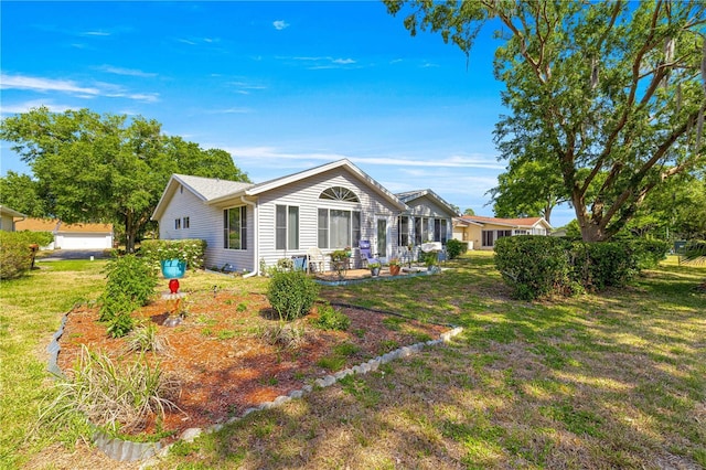 10989 SW 86th Ave, Ocala, FL 34481 - rear view of house featuring a yard and a patio area
