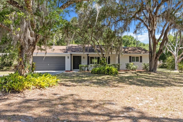 ranch-style home featuring an attached garage