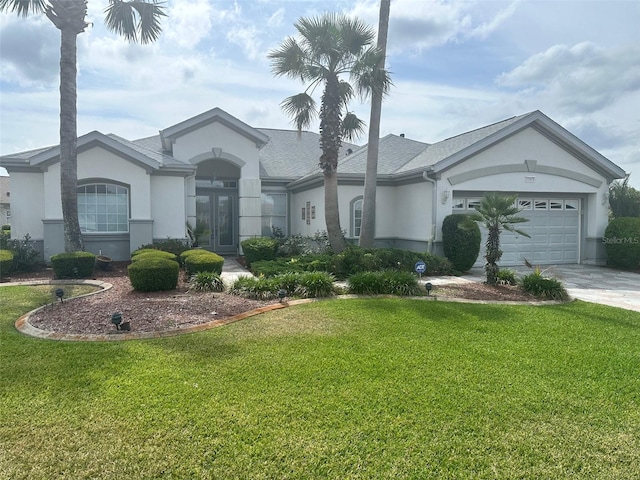 single story home featuring stucco siding, an attached garage, concrete driveway, and french doors