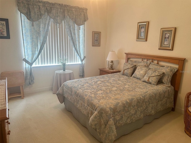 carpeted bedroom with baseboards