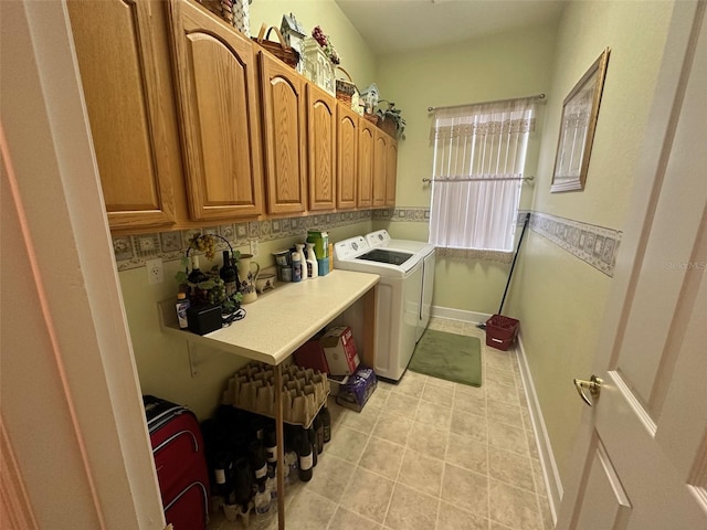 laundry room featuring washing machine and clothes dryer and light tile patterned floors