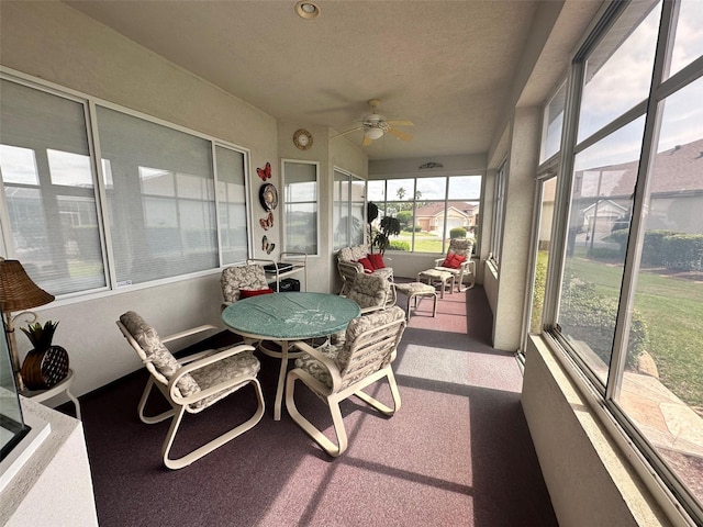 sunroom with ceiling fan