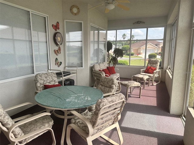 sunroom / solarium with ceiling fan