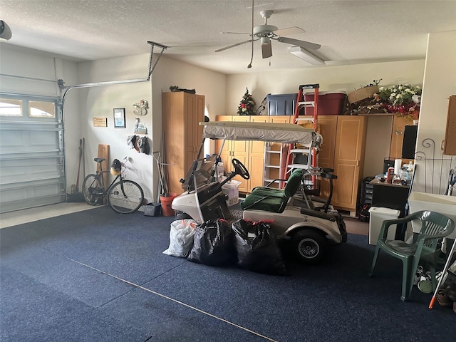 garage featuring a ceiling fan and a garage door opener