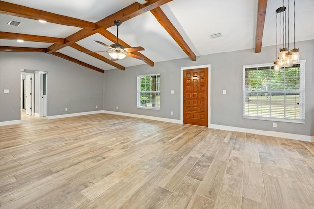 unfurnished living room with visible vents, baseboards, ceiling fan with notable chandelier, and lofted ceiling with beams