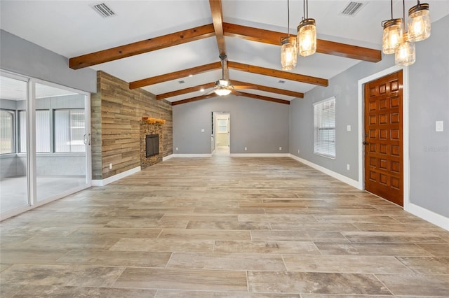 unfurnished living room featuring a large fireplace, visible vents, lofted ceiling with beams, and ceiling fan