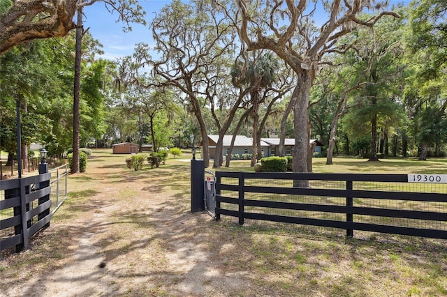 view of gate featuring fence