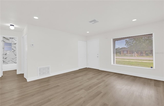 3807 SW 143rd Lane Rd, Ocala, FL 34473 - unfurnished room with light wood-type flooring, baseboards, and recessed lighting