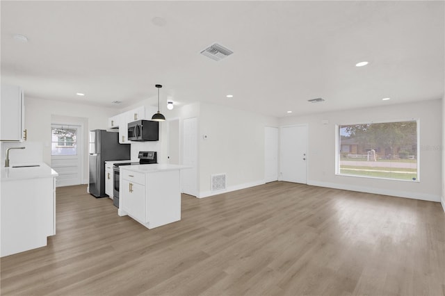 3807 SW 143rd Lane Rd, Ocala, FL 34473 - unfurnished living room with light wood-style flooring, recessed lighting, baseboards, and a sink