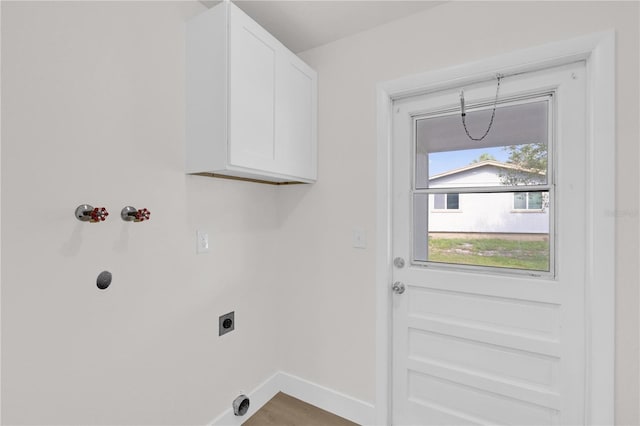 3807 SW 143rd Lane Rd, Ocala, FL 34473 - washroom with electric dryer hookup, cabinet space, and baseboards
