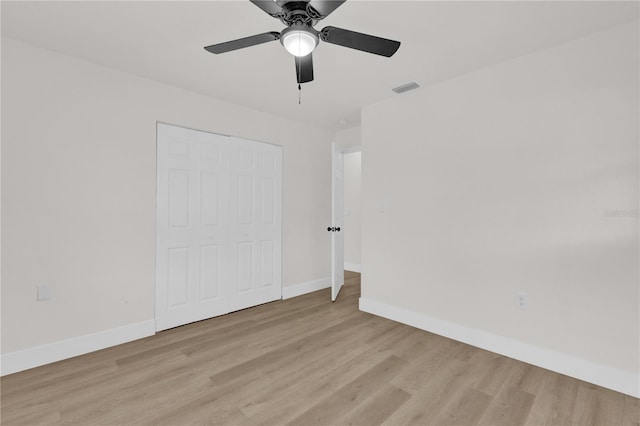 3807 SW 143rd Lane Rd, Ocala, FL 34473 - unfurnished bedroom featuring light wood-style floors, baseboards, a closet, and ceiling fan