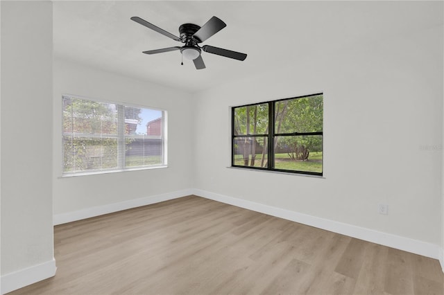 3807 SW 143rd Lane Rd, Ocala, FL 34473 - spare room with baseboards, light wood-style floors, and ceiling fan