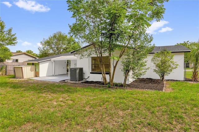 3807 SW 143rd Lane Rd, Ocala, FL 34473 - back of house featuring central AC unit and a patio area