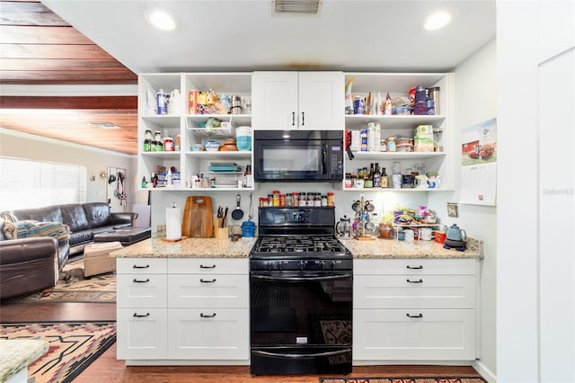 kitchen with open shelves, visible vents, white cabinetry, and black appliances