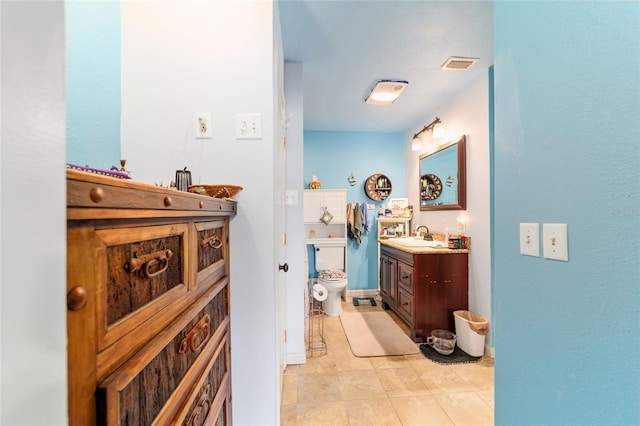 bathroom featuring visible vents, tile patterned flooring, vanity, and toilet