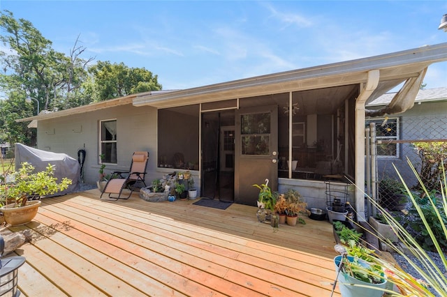 deck with a sunroom