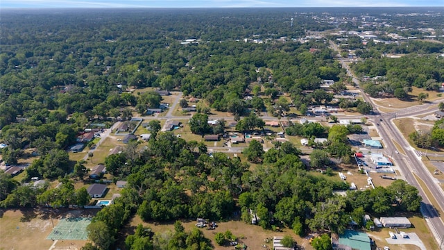 birds eye view of property with a wooded view