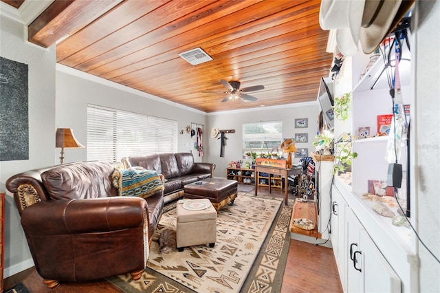 living area featuring light wood-type flooring, visible vents, ceiling fan, and ornamental molding