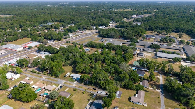 birds eye view of property with a forest view
