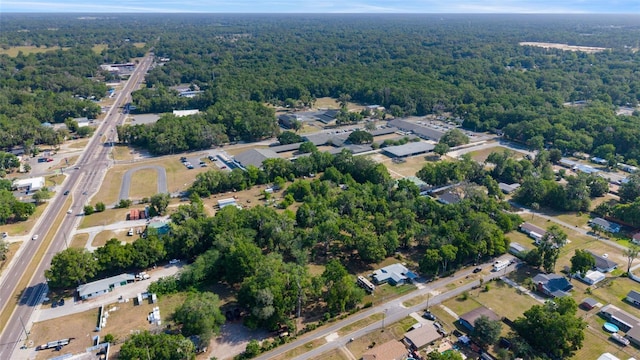 bird's eye view featuring a wooded view