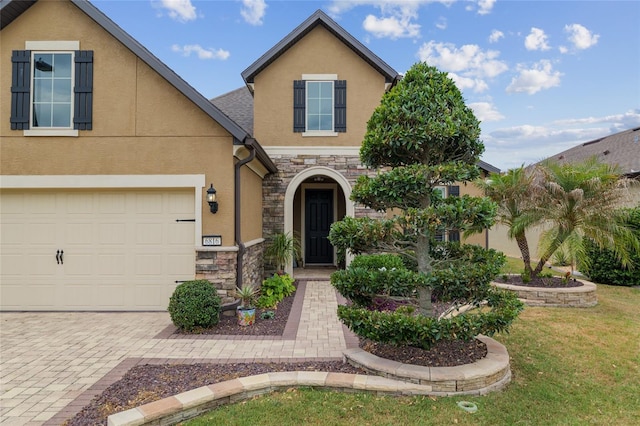 6816 SW 95th Cir, Ocala, FL 34481 - view of front of property with driveway, stone siding, a front lawn, and stucco siding