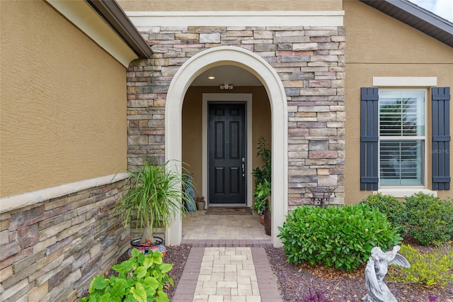 6816 SW 95th Cir, Ocala, FL 34481 - entrance to property with stucco siding and stone siding