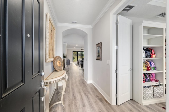 6816 SW 95th Cir, Ocala, FL 34481 - interior space with arched walkways, light wood-style floors, visible vents, and ornamental molding