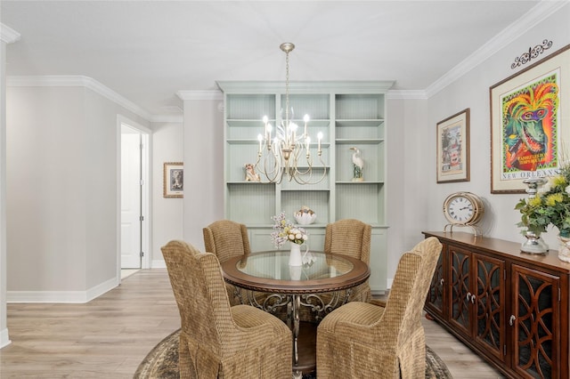 6816 SW 95th Cir, Ocala, FL 34481 - dining room with light wood-type flooring, a chandelier, and ornamental molding