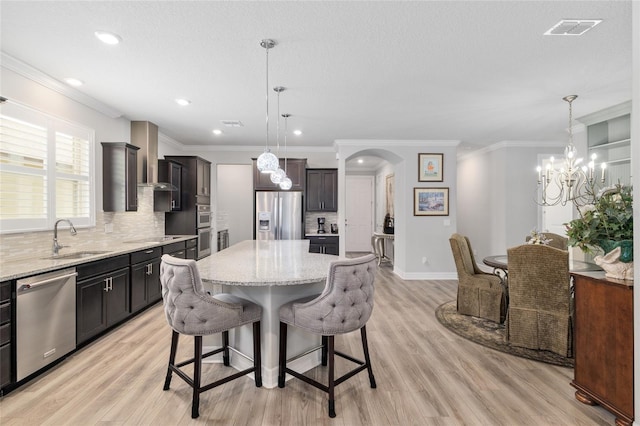 6816 SW 95th Cir, Ocala, FL 34481 - dining space with light wood-style floors, a notable chandelier, visible vents, baseboards, and arched walkways