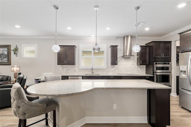 6816 SW 95th Cir, Ocala, FL 34481 - kitchen featuring visible vents, a sink, wall chimney exhaust hood, dark brown cabinetry, and appliances with stainless steel finishes