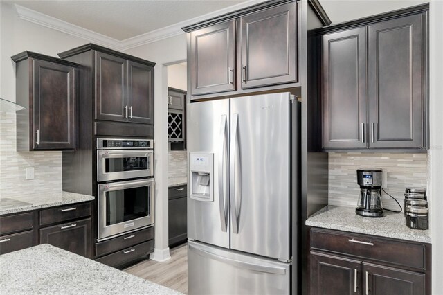 6816 SW 95th Cir, Ocala, FL 34481 - kitchen featuring decorative backsplash, appliances with stainless steel finishes, and dark brown cabinets