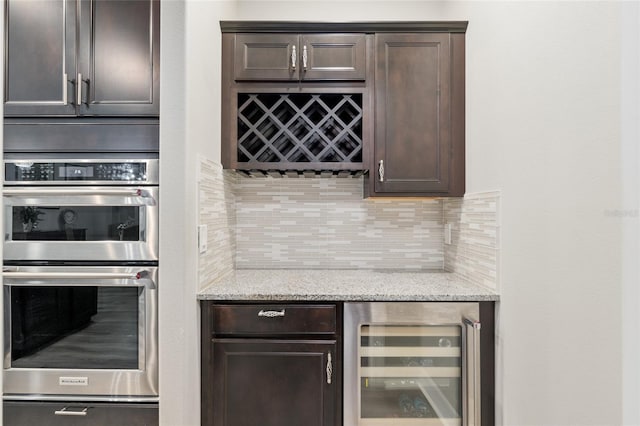 6816 SW 95th Cir, Ocala, FL 34481 - bar featuring double oven, wine cooler, a bar, a warming drawer, and tasteful backsplash