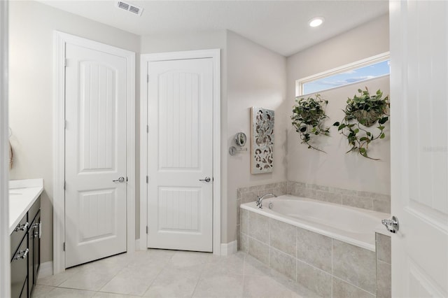 6816 SW 95th Cir, Ocala, FL 34481 - full bathroom with a bath, tile patterned floors, baseboards, visible vents, and vanity