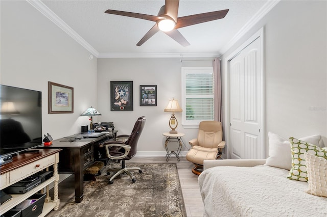 6816 SW 95th Cir, Ocala, FL 34481 - bedroom featuring wood finished floors, a ceiling fan, ornamental molding, a closet, and baseboards
