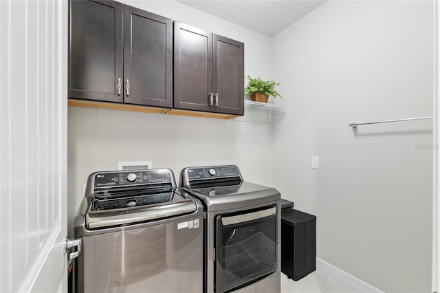 6816 SW 95th Cir, Ocala, FL 34481 - laundry room featuring washing machine and dryer, baseboards, and cabinet space