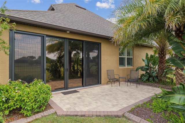 6816 SW 95th Cir, Ocala, FL 34481 - back of house with stucco siding, roof with shingles, and a patio