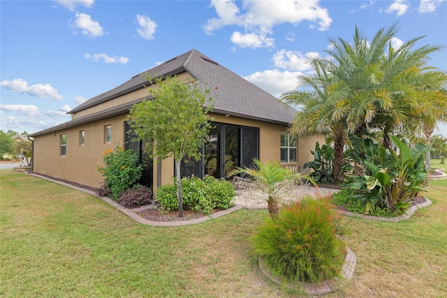 6816 SW 95th Cir, Ocala, FL 34481 - view of home's exterior with a lawn, stucco siding, and roof with shingles
