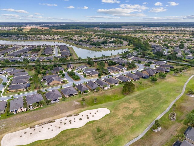 6816 SW 95th Cir, Ocala, FL 34481 - drone / aerial view featuring golf course view, a water view, and a residential view