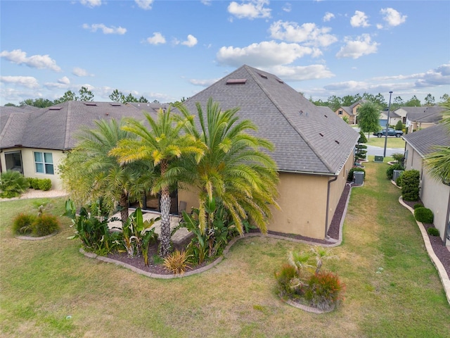 6816 SW 95th Cir, Ocala, FL 34481 - view of home's exterior featuring a yard, a residential view, central air condition unit, and stucco siding