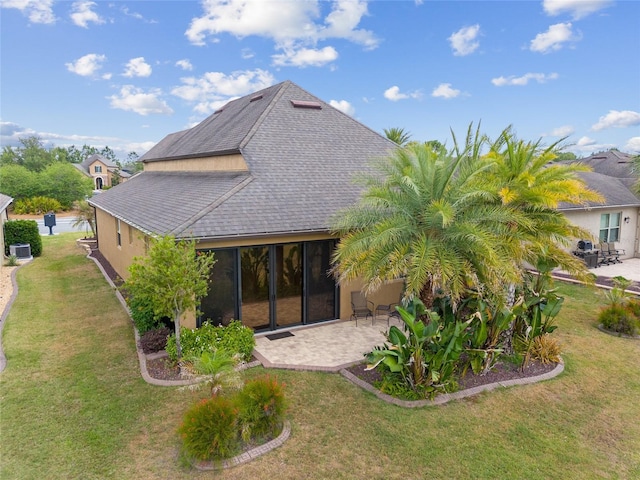 6816 SW 95th Cir, Ocala, FL 34481 - rear view of house featuring a lawn, roof with shingles, and a patio