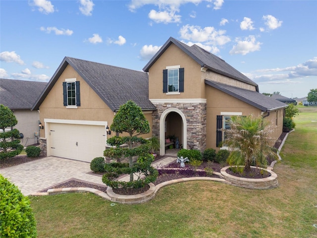 6816 SW 95th Cir, Ocala, FL 34481 - traditional home featuring stone siding, a front yard, stucco siding, and decorative driveway