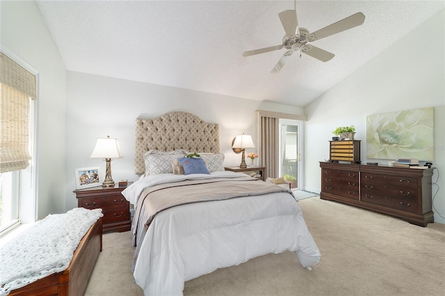 bedroom with lofted ceiling, light carpet, a ceiling fan, and multiple windows