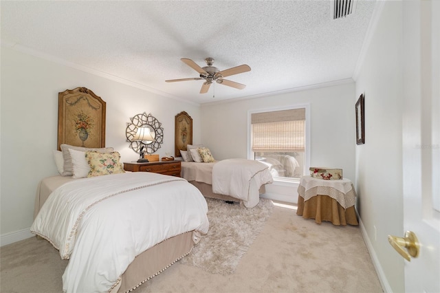 bedroom featuring baseboards, visible vents, crown molding, and light colored carpet