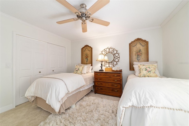 bedroom with ceiling fan, a closet, ornamental molding, and light carpet