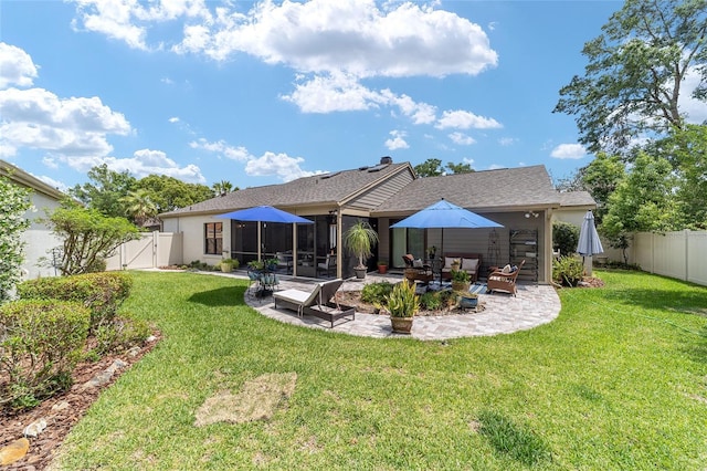 back of property featuring outdoor lounge area, a gate, a fenced backyard, a yard, and a patio
