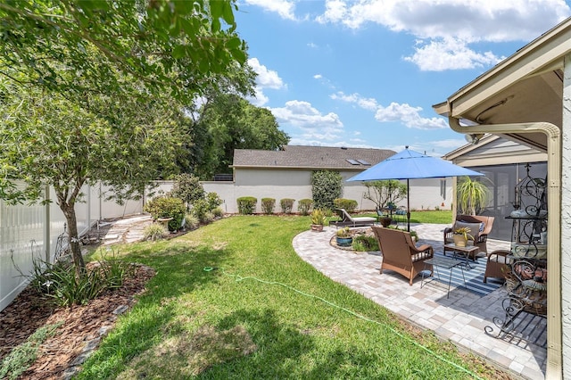 view of yard featuring an outdoor hangout area, a patio area, and a fenced backyard