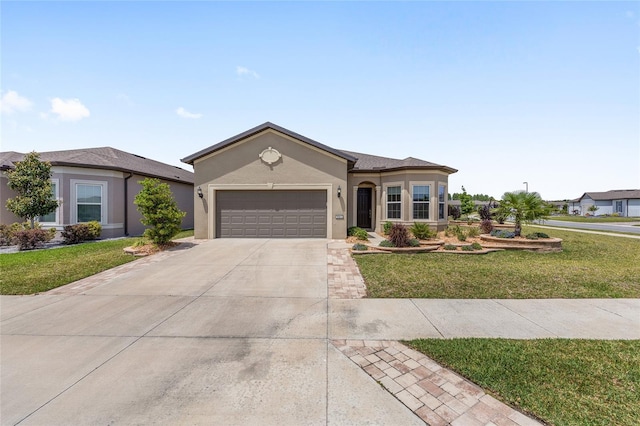 ranch-style home with stucco siding, an attached garage, driveway, and a front yard