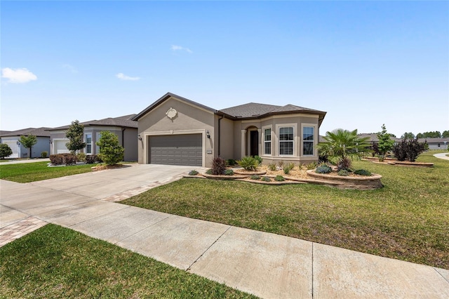 ranch-style house with a garage, stucco siding, a front yard, and concrete driveway
