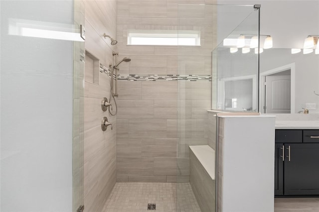 full bathroom featuring a shower stall and vanity
